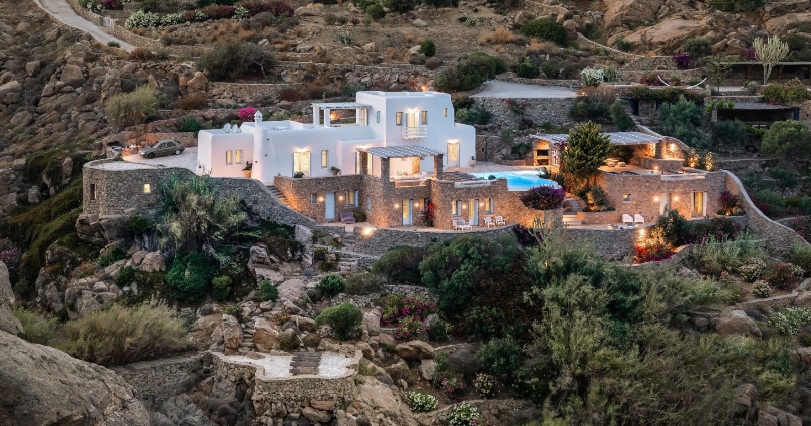 Aerial view of a luxury Mykonos villa estate at dusk